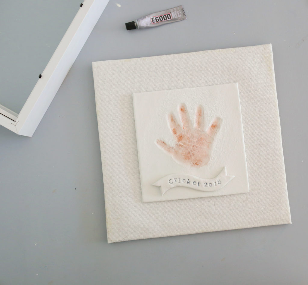 Apply metallic wax to your child's DIY handprint