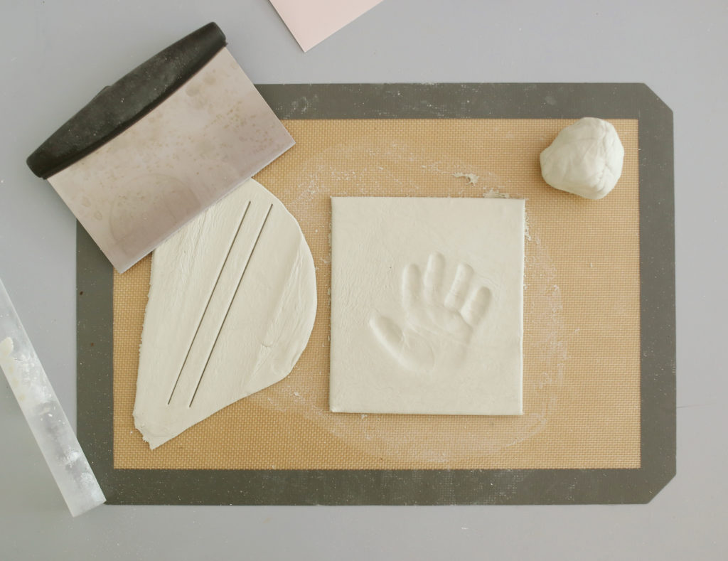 Step 4 of DIY clay handprint in a shadowbox 