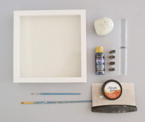 Supplies to make a DIY clay handprint in a frame